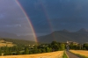 Paysages du Trièves. Photographie, ambiance après l&lsquo;orage, arc en ciel au dessus du village de Prébois.